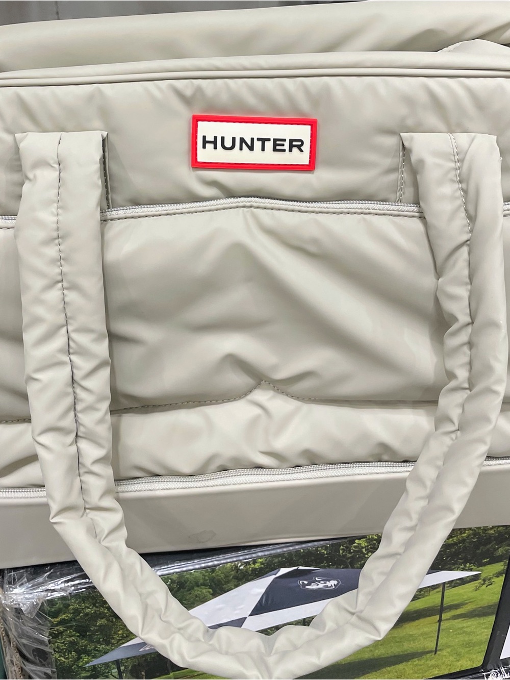 Hunter Cream Padded Duffel Bag with Red Logo Trim